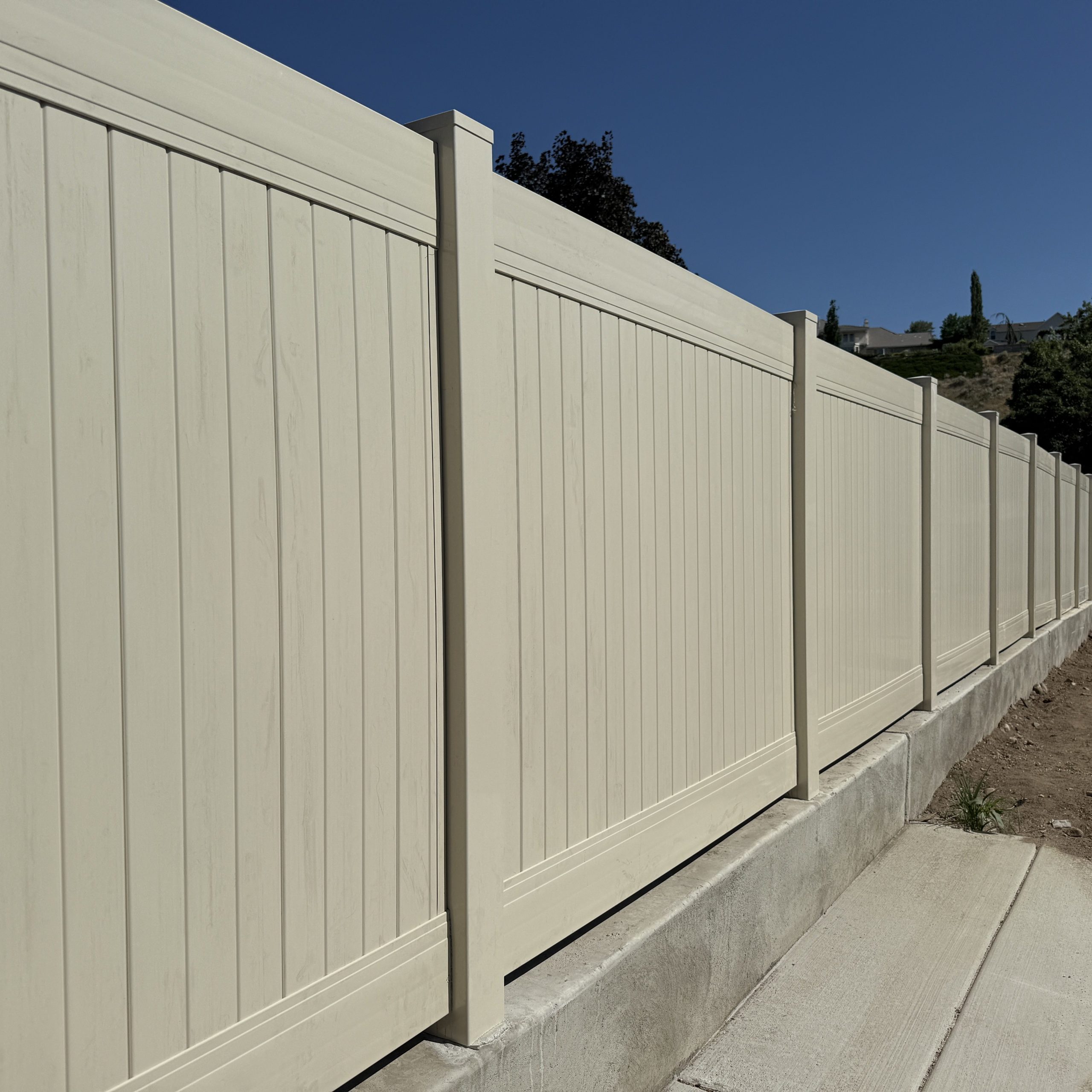 A different angle of the vinyl privacy fence installed in Herriman, UT